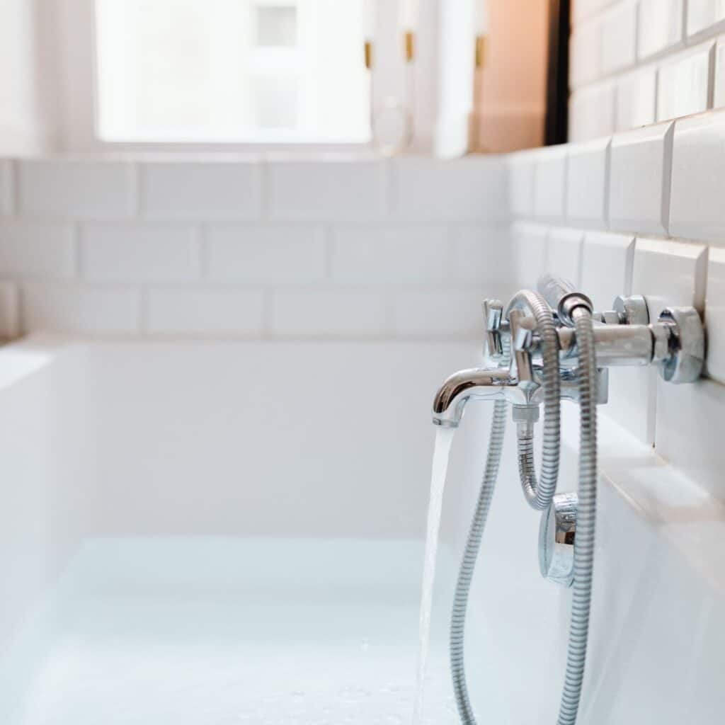 bathtub filling up with water