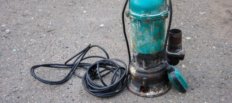 old submersible sewage pump on the ground
