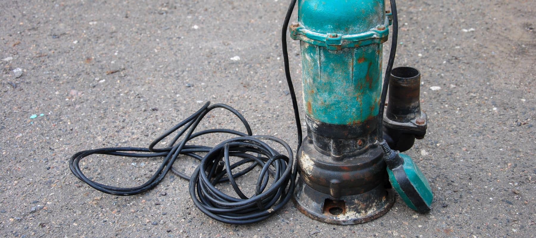 old submersible sewage pump on the ground